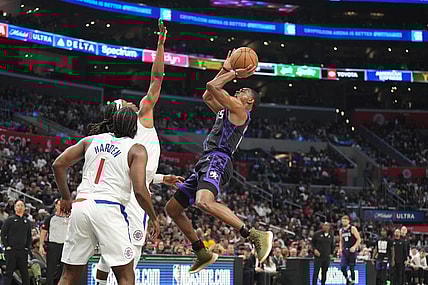 Feb 25, 2024; Los Angeles, California, USA; Sacramento Kings guard De'Aaron Fox (5) shoots the ball against LA Clippers guard Terance Mann (14) in the second half at Crypto.com Arena. Mandatory Credit: Kirby Lee-USA TODAY Sports