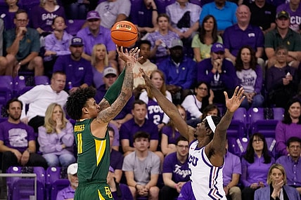 Feb 26, 2024; Fort Worth, Texas, USA; Baylor Bears forward Jalen Bridges (11) shoots over TCU Horned Frogs forward Emanuel Miller (2) during the first half at Ed and Rae Schollmaier Arena. Mandatory Credit: Raymond Carlin III-USA TODAY Sports