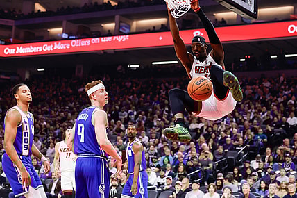 Feb 26, 2024; Sacramento, California, USA; Miami Heat center Bam Adebayo (13) dunks the ball against Sacramento Kings guard Kevin Huerter (9) during the first quarter at Golden 1 Center. Mandatory Credit: Sergio Estrada-USA TODAY Sports
