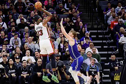 Feb 26, 2024; Sacramento, California, USA; Miami Heat center Bam Adebayo (13) shoots the ball over Sacramento Kings forward Domantas Sabonis (10) during the fourth quarter at Golden 1 Center. Mandatory Credit: Sergio Estrada-USA TODAY Sports