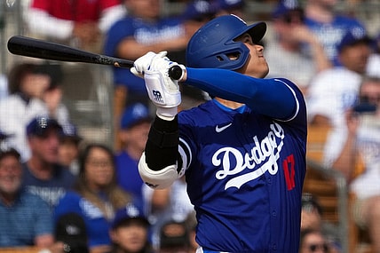 Feb 27, 2024; Phoenix, Arizona, USA; Los Angeles Dodgers designated hitter Shohei Ohtani (17) hits a two run home run during the fifth inning against the Chicago White Sox at Camelback Ranch-Glendale. Mandatory Credit: Joe Camporeale-USA TODAY Sports