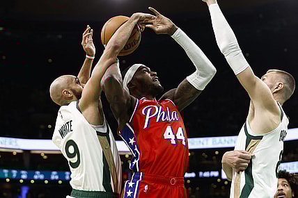 Feb 27, 2024; Boston, Massachusetts, USA; Boston Celtics guard Derrick White (9) knocks the ball away from Philadelphia 76ers forward Paul Reed (44) as he goes for a shot during the first quarter at TD Garden. Mandatory Credit: Winslow Townson-USA TODAY Sports