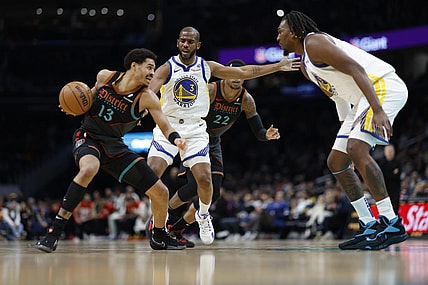 Feb 27, 2024; Washington, District of Columbia, USA; Washington Wizards guard Jordan Poole (13) drives to the basket as Golden State Warriors guard Chris Paul (3) defends in the first half at Capital One Arena. Mandatory Credit: Geoff Burke-USA TODAY Sports