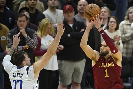 Feb 27, 2024; Cleveland, Ohio, USA; Cleveland Cavaliers guard Max Strus (1) makes a last-second, game-winning three-point basket beside Dallas Mavericks guard Luka Doncic (77) in the fourth quarter against at Rocket Mortgage FieldHouse. Mandatory Credit: David Richard-USA TODAY Sports
