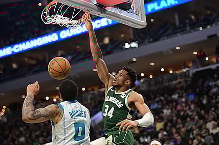 Feb 27, 2024; Milwaukee, Wisconsin, USA; Milwaukee Bucks forward Giannis Antetokounmpo (34) dunks the ball against Charlotte Hornets forward Miles Bridges (0) in the third quarter at Fiserv Forum. Mandatory Credit: Benny Sieu-USA TODAY Sports