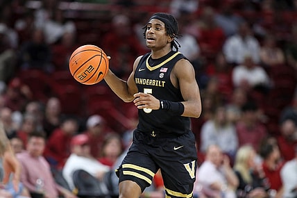 Feb 27, 2024; Fayetteville, Arkansas, USA; Vanderbilt Commodores guard Ezra Manjon (5) brings the ball up court during the first half against the Arkansas Razorbacks at Bud Walton Arena. Mandatory Credit: Nelson Chenault-USA TODAY Sports