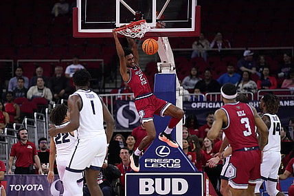 Feb 27, 2024; Fresno, California, USA; Fresno State Bulldogs guard Leo Colimerio (23) dunks the ball against the Utah State Aggies in the first half at the Save Mart Center. Mandatory Credit: Cary Edmondson-USA TODAY Sports