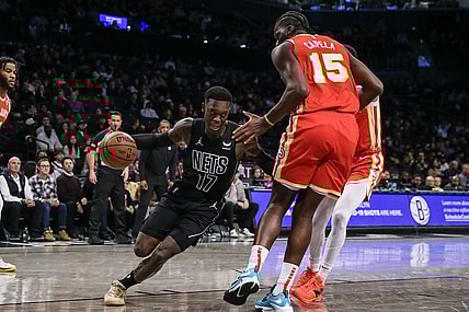 Feb 29, 2024; Brooklyn, New York, USA;  Brooklyn Nets guard Dennis Schroder (17) moves the ball against Atlanta Hawks center Clint Capela (15) in the first quarter at Barclays Center. Mandatory Credit: Wendell Cruz-USA TODAY Sports