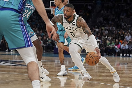 Feb 29, 2024; Charlotte, North Carolina, USA; Milwaukee Bucks guard Damian Lillard (0) moves to the basket against the Charlotte Hornets during the second quarter at Spectrum Center. Mandatory Credit: Jim Dedmon-USA TODAY Sports