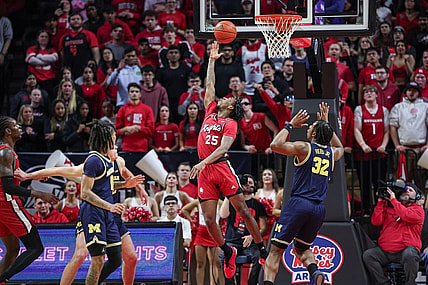 Feb 29, 2024; Piscataway, New Jersey, USA; Rutgers Scarlet Knights guard Jeremiah Williams (25) scores a basket in front of Michigan Wolverines forward Tarris Reed Jr. (32) during the first half at Jersey Mike's Arena. Mandatory Credit: Vincent Carchietta-USA TODAY Sports