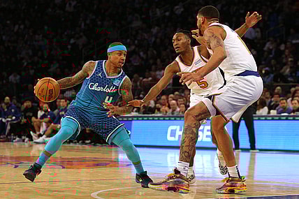 Mar 30, 2022; New York, New York, USA; Charlotte Hornets guard Isaiah Thomas (4) controls the ball against New York Knicks guard Immanuel Quickley (5) and forward Obi Toppin (1) during the second quarter at Madison Square Garden. Mandatory Credit: Brad Penner-USA TODAY Sports