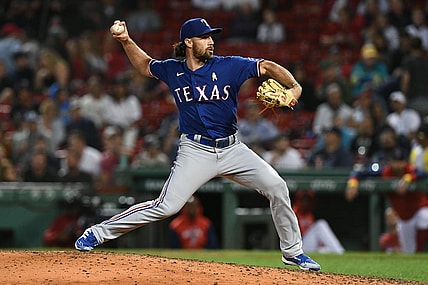 Sep 2, 2022; Boston, Massachusetts, USA; Texas Rangers third baseman Charlie Culberson (11) pitches against the Boston Red Sox during the eighth inning at Fenway Park. Mandatory Credit: Brian Fluharty-USA TODAY Sports