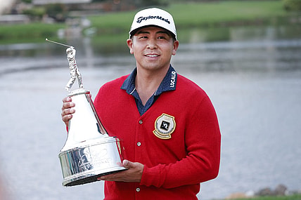 Mar 5, 2023; Orlando, Florida, USA;  Kurt Kitayama holds the champions trophy after winning the Arnold Palmer Invitational golf tournament. Mandatory Credit: Reinhold Matay-USA TODAY Sports