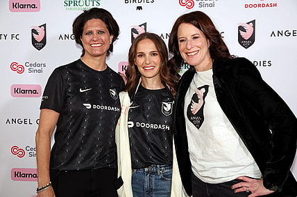 Mar 26, 2023; Los Angeles, California, USA; Angel City FC co-founder Julie Uhrman (left) and co-founder Natalie Portman (center) and co-founder Kara Nortman pose for a photo on the pink carpet before the game against New Jersey/New York Gotham FC at BMO Stadium. Mandatory Credit: Kiyoshi Mio-USA TODAY Sports