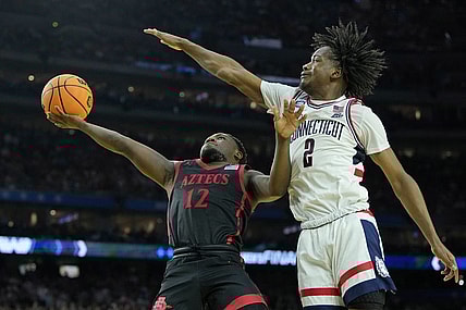 Apr 3, 2023; Houston, TX, USA; San Diego State Aztecs guard Darrion Trammell (12) shoots the ball against Connecticut Huskies guard Tristen Newton (2) during the second half in the national championship game of the 2023 NCAA Tournament at NRG Stadium. Mandatory Credit: Bob Donnan-USA TODAY Sports