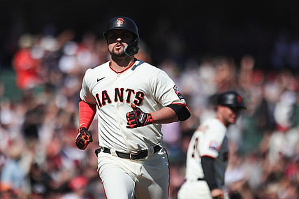 Sep 13, 2023; San Francisco, California, USA; San Francisco Giants third baseman J.D. Davis (7) reacts after hitting a three run home run during the eighth inning against the Cleveland Guardians at Oracle Park. Mandatory Credit: Sergio Estrada-USA TODAY Sports