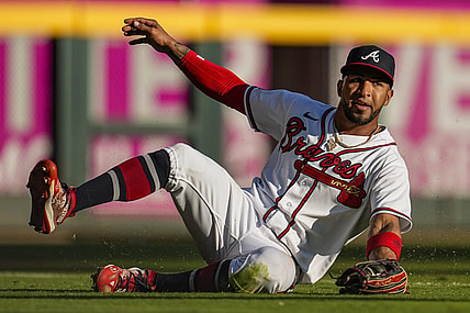 Oct 1, 2023; Cumberland, Georgia, USA; Atlanta Braves left fielder Eddie Rosario (8) makes a sliding catch on a ball hit by Washington Nationals shortstop CJ Abrams (5) (not shown) during the eighth inning at Truist Park. Mandatory Credit: Dale Zanine-USA TODAY Sports