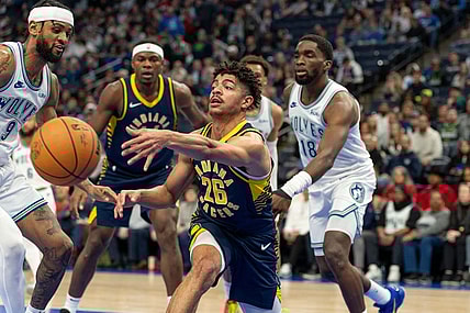 Dec 16, 2023; Minneapolis, Minnesota, USA; Indiana Pacers guard Ben Sheppard (26) passes the ball while defended by Minnesota Timberwolves guard Nickeil Alexander-Walker (9) in the fourth quarter at Target Center. Mandatory Credit: Matt Blewett-USA TODAY Sports