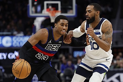 Jan 17, 2024; Detroit, Michigan, USA; Detroit Pistons guard Jaden Ivey (23) dribbles defended by Minnesota Timberwolves guard Mike Conley (10) in the second half at Little Caesars Arena. Mandatory Credit: Rick Osentoski-USA TODAY Sports