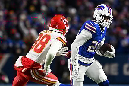 Jan 21, 2024; Orchard Park, New York, USA; Buffalo Bills running back Latavius Murray (28) rushes the ball against  Kansas City Chiefs cornerback L'Jarius Sneed (38)in the first half of the 2024 AFC divisional round game at Highmark Stadium. Mandatory Credit: Mark Konezny-USA TODAY Sports
