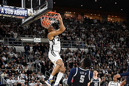 Jan 27, 2024; Providence, Rhode Island, USA; Providence Friars guard Devin Carter (22)  makes a reverse dunk during the first half against the Georgetown Hoyas at Amica Mutual Pavilion. Mandatory Credit: Eric Canha-USA TODAY Sports