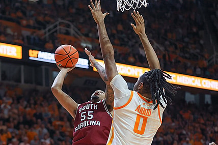 Jan 30, 2024; Knoxville, Tennessee, USA; South Carolina Gamecocks guard Ta'Lon Cooper (55) goes to the basket against Tennessee Volunteers forward Jonas Aidoo (0) during the second half at Thompson-Boling Arena at Food City Center. Mandatory Credit: Randy Sartin-USA TODAY Sports