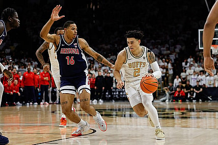 Feb 10, 2024; Boulder, Colorado, USA; Colorado Buffaloes guard KJ Simpson (2) controls the ball against Arizona Wildcats forward Keshad Johnson (16) in the second half at CU Events Center. Mandatory Credit: Isaiah J. Downing-USA TODAY Sports