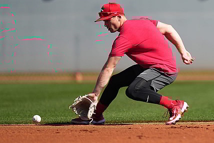 Cincinnati Reds shortstop Matt McLain (9) fields a groundball during spring training workouts, Wednesday, Feb. 14, 2024, at the team   s spring training facility in Goodyear, Ariz.