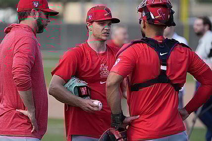 Feb 15, 2024; Jupiter, FL, USA;  St. Louis Cardinals starting pitcher Sonny Gray, center, talks with catcher Ivan Herrera (48) during workouts at spring training. Mandatory Credit: Jim Rassol-USA TODAY Sports