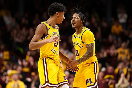 Feb 22, 2024; Minneapolis, Minnesota, USA; Minnesota Golden Gophers guard Elijah Hawkins (0) celebrates after guard Cam Christie's (24) three-point basket against the Ohio State Buckeyes during the second half at Williams Arena. Mandatory Credit: Matt Krohn-USA TODAY Sports