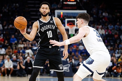 Feb 26, 2024; Memphis, Tennessee, USA; Brooklyn Nets guard Ben Simmons (10) passes the ball as Memphis Grizzlies forward Jake LaRavia (3) defends during the second half at FedExForum. Mandatory Credit: Petre Thomas-USA TODAY Sports