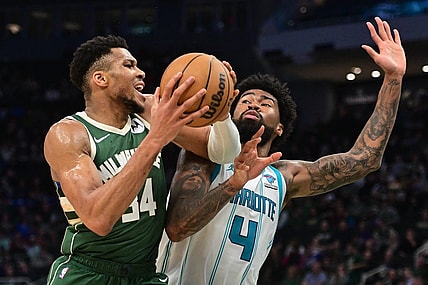 Feb 27, 2024; Milwaukee, Wisconsin, USA; Milwaukee Bucks forward Giannis Antetokounmpo (34) drives for the basket against Charlotte Hornets center Nick Richards (4) in the third quarter at Fiserv Forum. Mandatory Credit: Benny Sieu-USA TODAY Sports