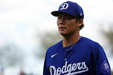 Feb 28, 2024; Surprise, Arizona, USA; Los Angeles Dodgers starting pitcher Yoshinobu Yamamoto (18) returns to the dugout during the first inning against the Texas Rangers at Surprise Stadium. Mandatory Credit: Joe Camporeale-USA TODAY Sports