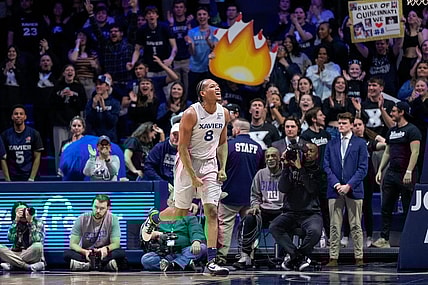 Xavier Musketeers guard Quincy Olivari (8) celebrates in the second half of the NCAA Big East conference basketball game between the Xavier Musketeers and the DePaul Blue Demons at the Cintas Center in Cincinnati on Wednesday, Feb. 28, 2024.