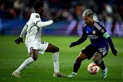 FC Cincinnati midfielder Luciano Acosta (10) handles the ball as Cavalier FC midfielder Dwayne Allen (13) guards him in the second half of the MLS match between the FC Cincinnati and the Cavalier FC at TQL Stadium in Cincinnati on Wednesday, Feb. 28, 2024.