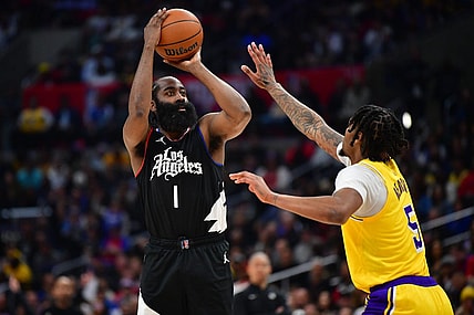 Feb 28, 2024; Los Angeles, California, USA; Los Angeles Clippers guard James Harden (1) shoots against Los Angeles Lakers forward Cam Reddish (5) during the second half at Crypto.com Arena. Mandatory Credit: Gary A. Vasquez-USA TODAY Sports
