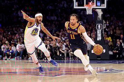 Feb 29, 2024; New York, New York, USA; New York Knicks guard Jalen Brunson (11) controls the ball against Golden State Warriors guard Moses Moody (4) during the first quarter at Madison Square Garden. Mandatory Credit: Brad Penner-USA TODAY Sports