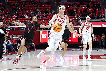 Feb 29, 2024; Salt Lake City, Utah, USA; Stanford Cardinal guard Kanaan Carlyle (3) knocks the ball away from Utah Utes center Branden Carlson (35) during the second half at Jon M. Huntsman Center. Mandatory Credit: Rob Gray-USA TODAY Sports