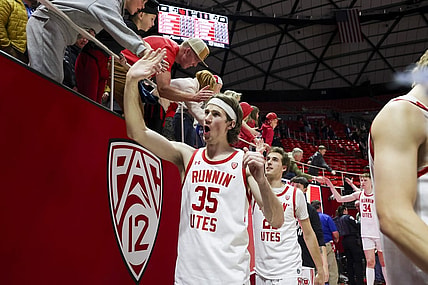 Feb 29, 2024; Salt Lake City, Utah, USA; Utah Utes center Branden Carlson (35) slaps hands with fans after the win against the Stanford Cardinal at Jon M. Huntsman Center. Mandatory Credit: Rob Gray-USA TODAY Sports