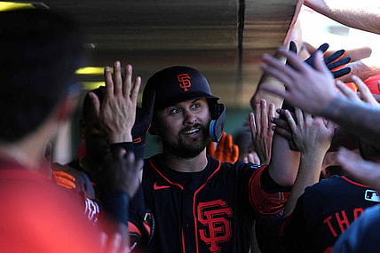 Mar 1, 2024; Scottsdale, Arizona, USA; San Francisco Giants first baseman J.D. Davis (7) celebrates with teammates after hitting a home run against the Texas Rangers during the second inning at Scottsdale Stadium. Mandatory Credit: Joe Camporeale-USA TODAY Sports