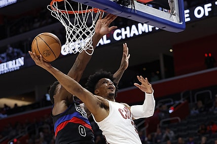 Mar 1, 2024; Detroit, Michigan, USA;  Cleveland Cavaliers forward Isaac Okoro (35) shoots on Detroit Pistons center Jalen Duren (0) in the first half at Little Caesars Arena. Mandatory Credit: Rick Osentoski-USA TODAY Sports
