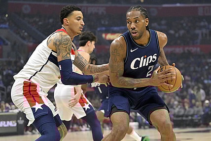 Mar 1, 2024; Los Angeles, California, USA; Los Angeles Clippers forward Kawhi Leonard (2) is defended by Washington Wizards forward Kyle Kuzma (33) in the first half at Crypto.com Arena. Mandatory Credit: Jayne Kamin-Oncea-USA TODAY Sports