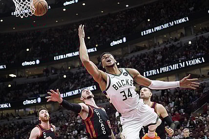 Mar 1, 2024; Chicago, Illinois, USA; Chicago Bulls guard Alex Caruso (6) fouls Milwaukee Bucks forward Giannis Antetokounmpo (34) during the second half at United Center. Mandatory Credit: David Banks-USA TODAY Sports