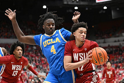 Mar 2, 2024; Pullman, Washington, USA; Washington State Cougars guard Isaiah Watts (12) controls the ball against UCLA Bruins guard Will McClendon (4) in the first half at Friel Court at Beasley Coliseum. Mandatory Credit: James Snook-USA TODAY Sports