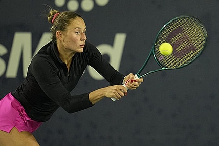 Mar 2, 2024; San Diego, CA, USA; Marta Kostyuk of Ukraine hits a backhand against Jessica Pegula of the United States (not pictured) during the second set of the semifinals of the San Diego Open at Barnes Tennis Center. Mandatory Credit: Ray Acevedo-USA TODAY Sports