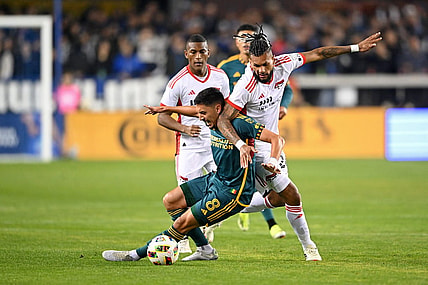 Mar 2, 2024; San Jose, California, USA; San Jose Earthquakes forward Will Richmond (20) battles for the ball against LA Galaxy midfielder Mark Delgado (8) during the first half at PayPal Park. Mandatory Credit: Robert Edwards-USA TODAY Sports