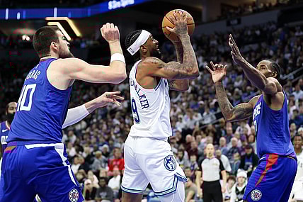 Mar 3, 2024; Minneapolis, Minnesota, USA; Minnesota Timberwolves guard Nickeil Alexander-Walker (9) shoots as LA Clippers center Ivica Zubac (40) and LA Clippers forward Kawhi Leonard (2) defend during the first half at Target Center. Mandatory Credit: Matt Krohn-USA TODAY Sports
