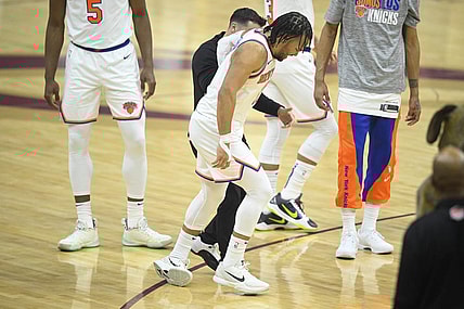 Mar 3, 2024; Cleveland, Ohio, USA; New York Knicks guard Jalen Brunson (11) limps off the court in the first quarter against the Cleveland Cavaliers at Rocket Mortgage FieldHouse. Mandatory Credit: David Richard-USA TODAY Sports