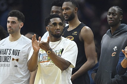 Mar 3, 2024; Cleveland, Ohio, USA; Cleveland Cavaliers guard Donovan Mitchell (front) reacts in the second quarter against the New York Knicks at Rocket Mortgage FieldHouse. Mandatory Credit: David Richard-USA TODAY Sports