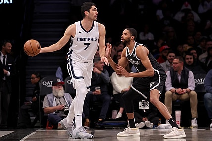 Mar 4, 2024; Brooklyn, New York, USA; Memphis Grizzlies forward Santi Aldama (7) controls the ball against Brooklyn Nets forward Mikal Bridges (1) during the first quarter at Barclays Center. Mandatory Credit: Brad Penner-USA TODAY Sports